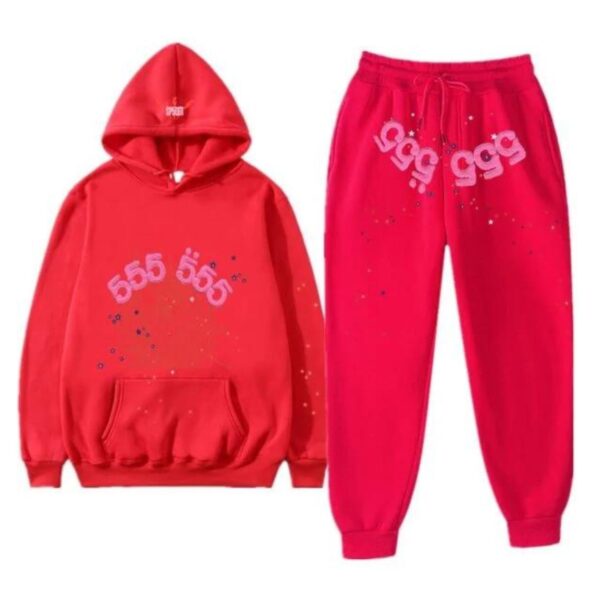 Fashion-forward model in the red Sp5der 555555 Tracksuit pant and hoodie