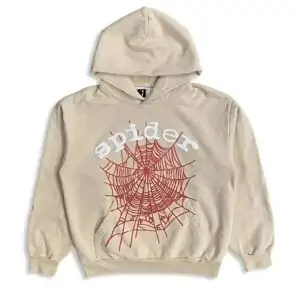 A high-resolution image of the cream SP5DER LOGO HOODIE on a mannequin